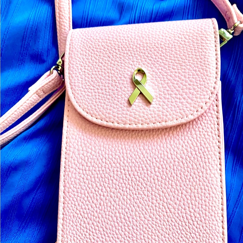 Pink crossbody purse in honor of Breast Cancer Awareness Never used.